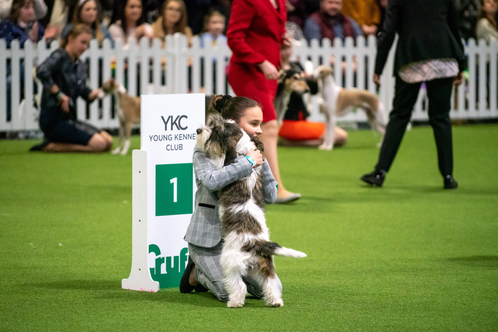Dog and handler cuddling
